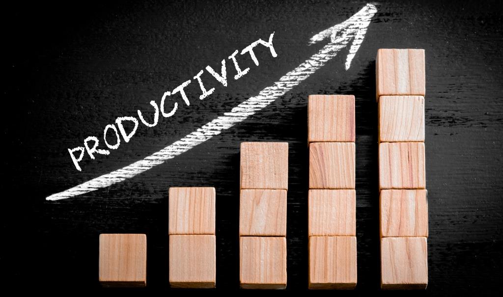  Illustration of wooden blocks of increasing height with the word 'Productivity' written above them in white chalk on a blackboard.